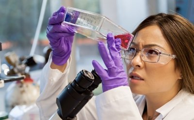 Process scientist working with cell culture media