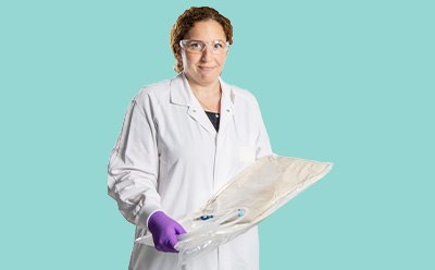 Scientist holding a ReadyStream media bag Scientist holding a ReadyStream media bag