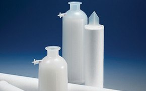 Three cylindrical white clarification filters designed to remove particles and microorganisms from pharmaceutical and biopharmaceutical process streams. The filters are set against a blue background.