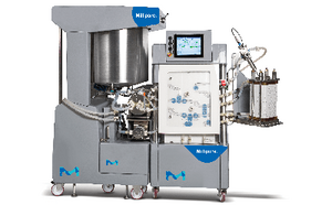 An industrial pharmaceutical machine with a large mixing vessel, control panel, and various tubes and attachments.