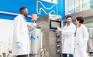 Worker loading upstream chemicals for bioprocessing