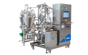 a complex industrial machine, primarily grey with blue accents, featuring a large stainless steel mixing bowl, a control panel with buttons and a screen, and additional mechanical parts such as pipes and valves.