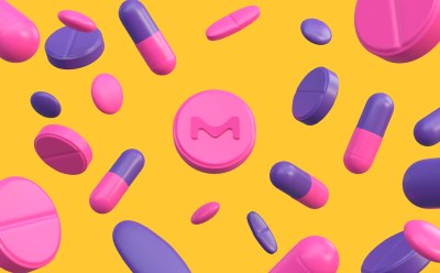 Various pink and purple pills and capsules scattered on a bright yellow background. One prominent round pink pill in the middle of the picture features the letter "M" embossed on it. Various pink and purple pills and capsules scattered on a bright yellow background. One prominent round pink pill in the middle of the picture features the letter "M" embossed on it.