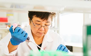 Female scientist conducting an experiment.