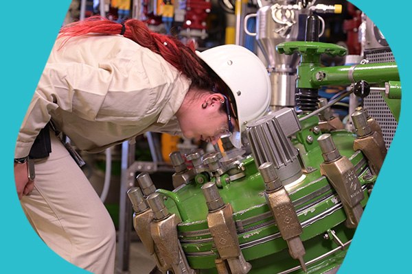 Large Scale API Production Operator checks reactor for large scale API production.