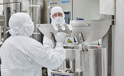Production Site - Carlsbad CA scientists in a manufacturing facility