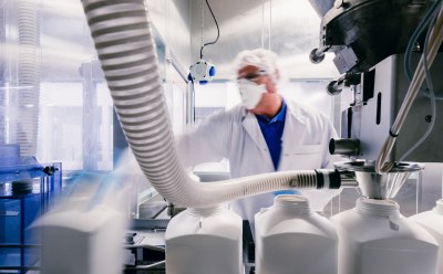 Large scale materials and custom specifications for manufacturing Process engineer checking the filling system in production area