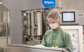 Early Clinical Offering Female operator working on IVT reactor console