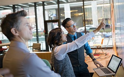A group of people in a meeting A group of people in a meeting
