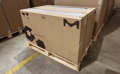 Pallet of shipping boxes with new 100% paper-based edge protectors. Pallet of shipping boxes with new 100% paper-based edge protectors.