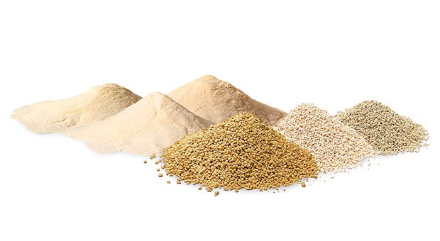 NutriSelect<sup>®</sup> powdered and GranuCult<sup>®</sup> granulated culture media Two distinct piles of culture media, with the left side showing powdered NutriSelect® media in light beige, and the right side displaying granulated GranuCult® media in various shades of brown and beige, set against a white background.